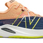 Tênis de corrida New Balance FuelCell Rebel v2 feminino Night Tide/Manga