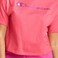 Camiseta curta feminina Champion com logo rosa, tamanho médio