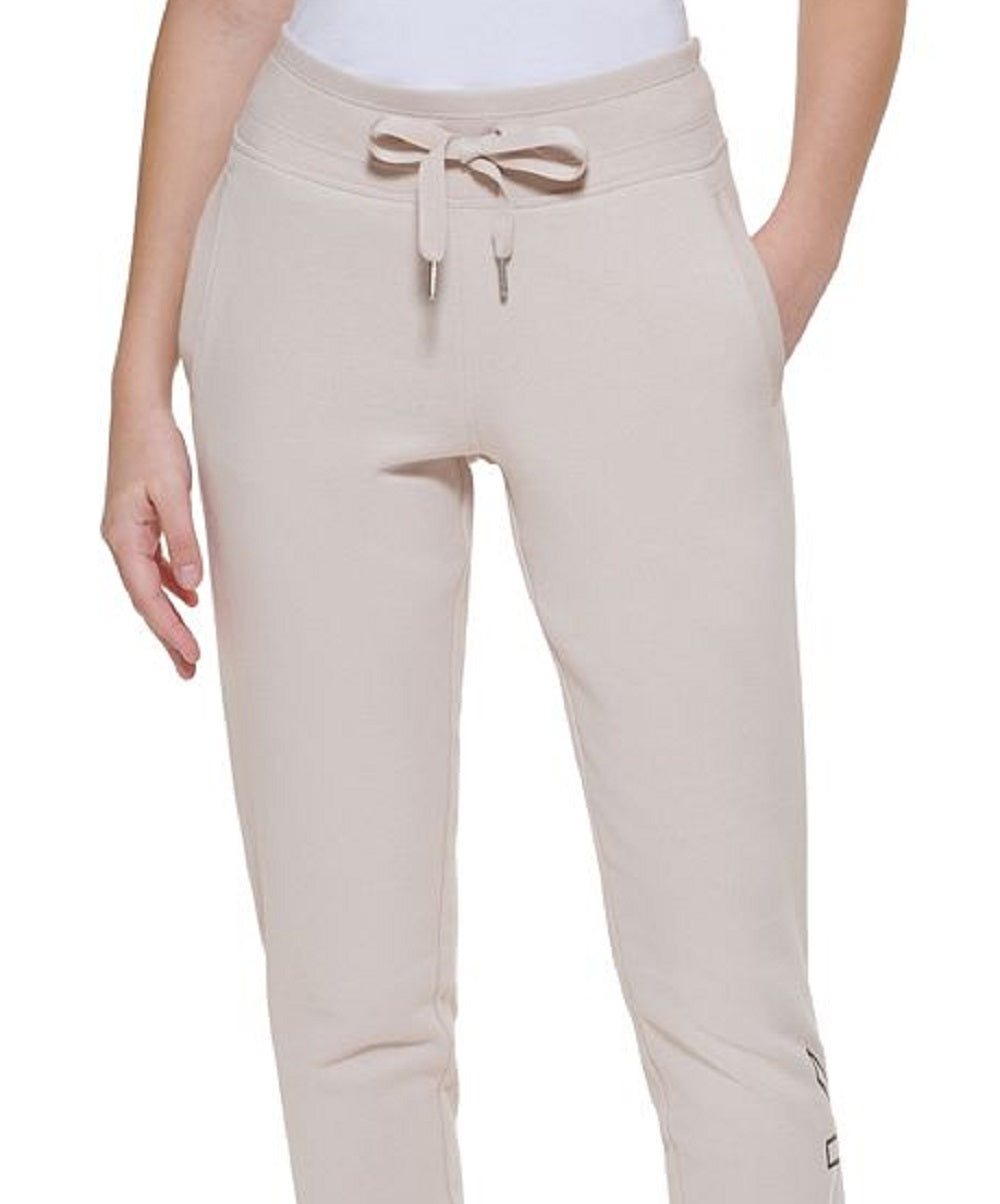 Calça jogger Calvin Klein feminina Outline Logo bege tamanho médio