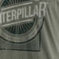 Camiseta masculina com estampa de logotipo desgastado da Caterpillar Foundation, verde, tamanho GG