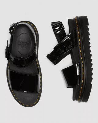 Dr. Martens - Sandálias femininas Voss em couro envernizado com tiras