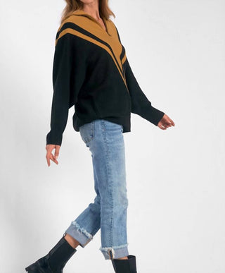 Elan - Suéter Chevron com zíper em um quarto