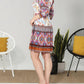 Paparazzi - Border Print Smocked Dress