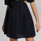 E agora este minivestido feminino de algodão com decote em V, preto, tamanho médio
