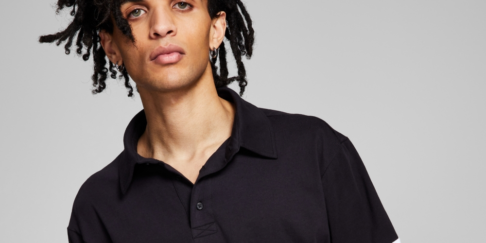 E agora esta camisa de rugby masculina com blocos de cores, preta, tamanho XX-G