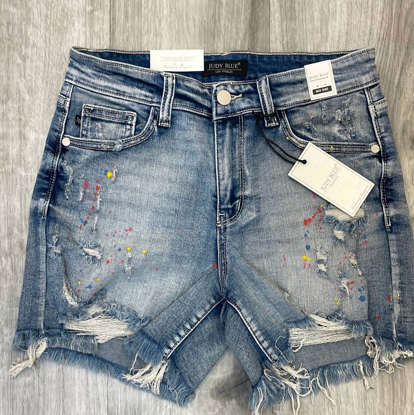 Judy Blue - Mid-rise Rainbow Paint Splash Cut Off Shorts