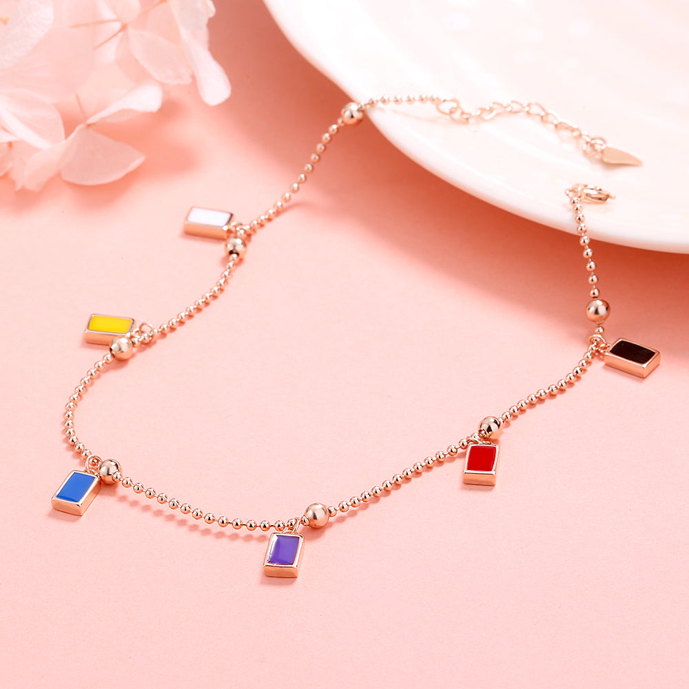 Tornozeleira com pingente multicolorido em ouro rosa