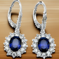 Brincos de alavanca Halo de safira em ouro branco 18K