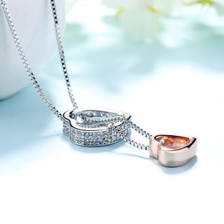 Colar de cristal em dois tons com coração em ouro branco e rosa 18K com a inscrição "Te amo"