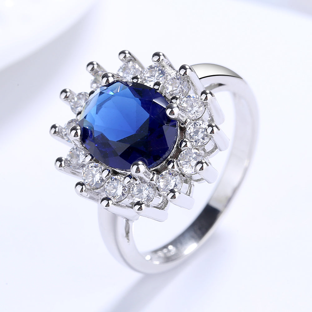 Anel de coquetel Halo Blue Sapphire em prata esterlina e ouro branco