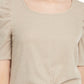 Blusa com manga bufante e torção frontal BCX Junior, bege, tamanho grande