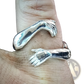 Adjustable Silver Hands Embracing Ring with Red Gemstone