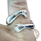 Adjustable Silver Hands Embracing Ring with Red Gemstone