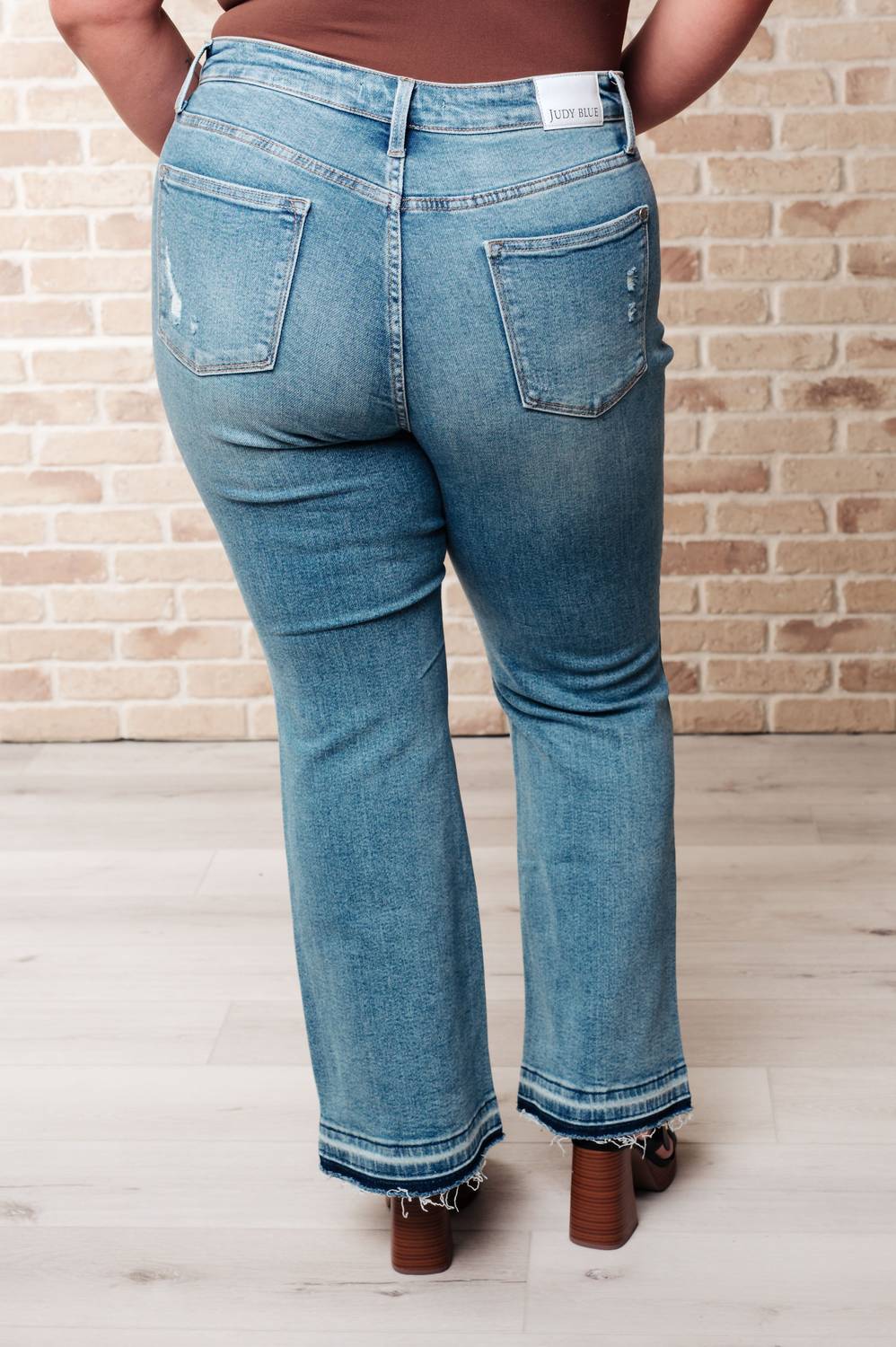 Judy Blue - Mid Rise Distressed Released Hem Bootcut Jeans