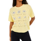 Camiseta cropped com estampa Daisy da Rebellious One Junior, amarela, tamanho X-G